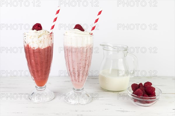 Close up milkshake glasses with whipped cream