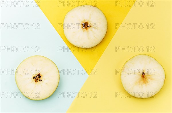 Sliced pear colored background
