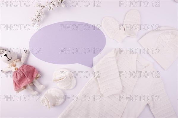 Baby clothes with empty speech bubble