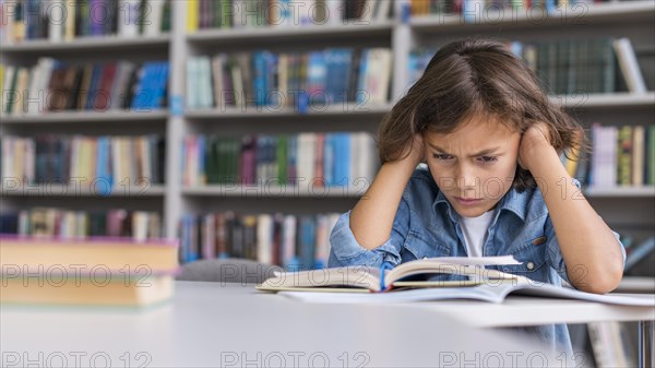 Boy thinking hard about how solve his homework with