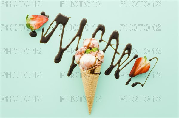 Ice cream waffle cone with chocolate syrup