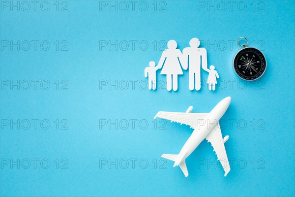 Top view paper cut family concept with compass