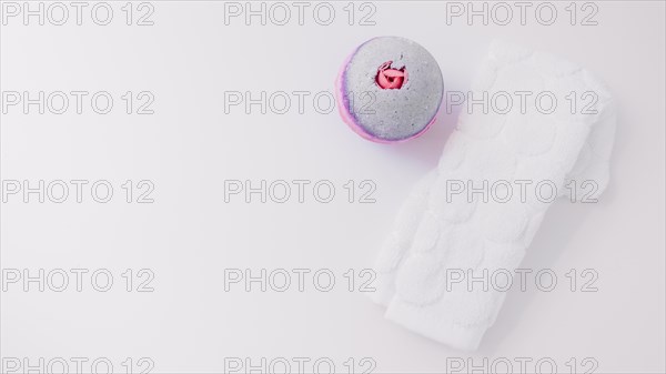 Elevated view bath bomb white folded napkin white background