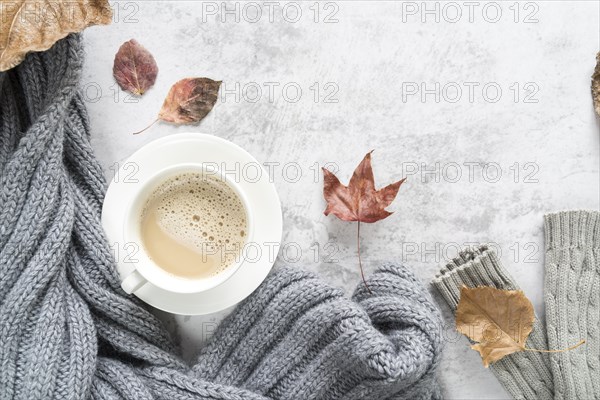 Hot beverage with warm sweater light surface