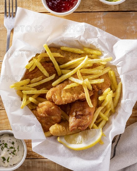 Top view fish chips with ketchup sauce