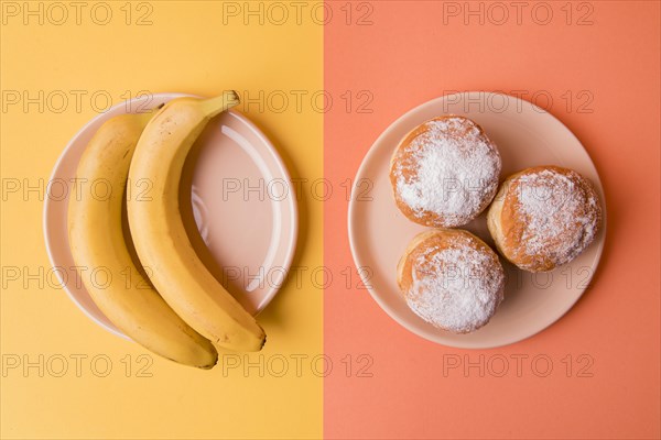 Top view bananas donuts