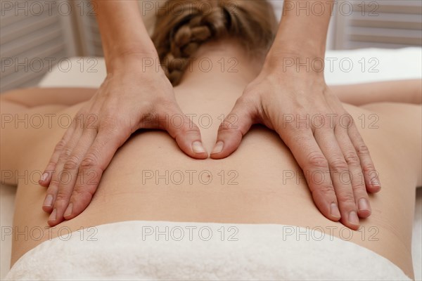 Close up therapist massaging back