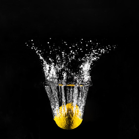 Lemon plunging into water