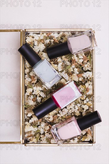 Pink gray nail varnish bottles dried white