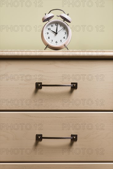 Alarm clock top wooden cabinet