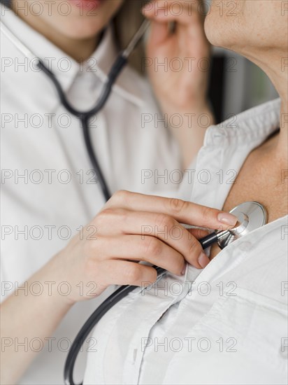 Doctor checking old patient