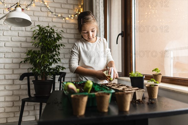 Young girl planting crops home