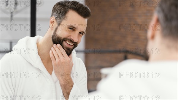 Man taking good care his face home