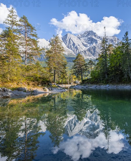 Zugspitze massif and Zugspitze reflected in Eibsee lake