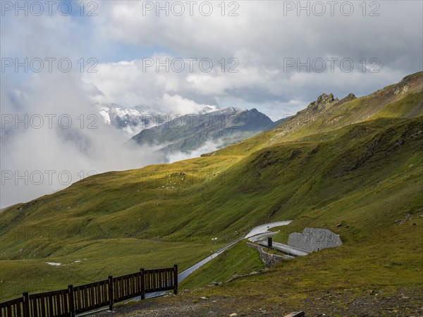 Morning fog drifts over a mountain ridge