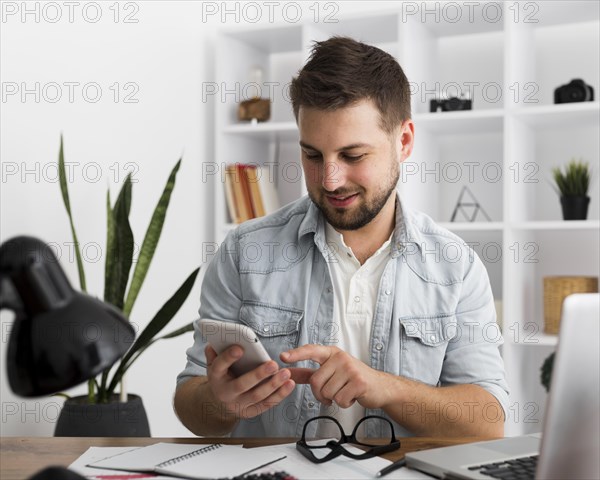 Portrait casual male browsing mobile phone