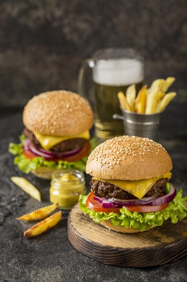 High angle burgers with fries sauce beer