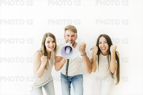 People cheering with megaphone studio