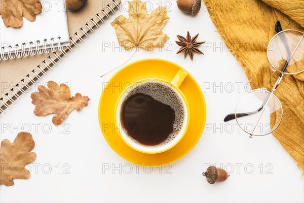 Top view coffee cup with glasses autumn leaves