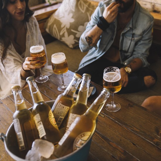 Friends with beers bucket