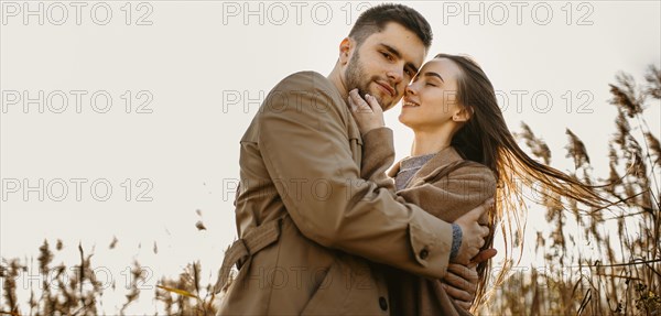 Low angle happy couple nature