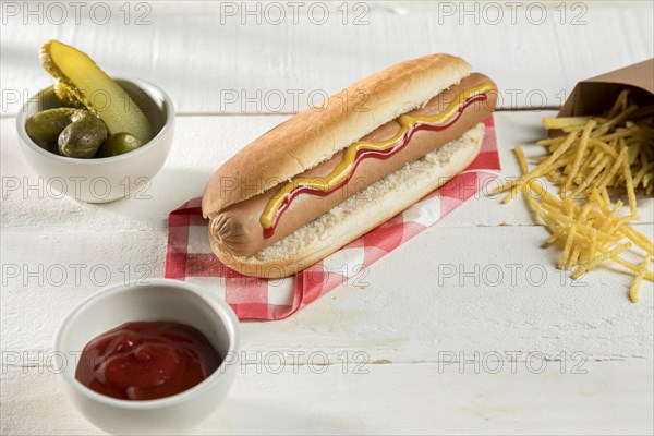 Hot dog with cheese condiments