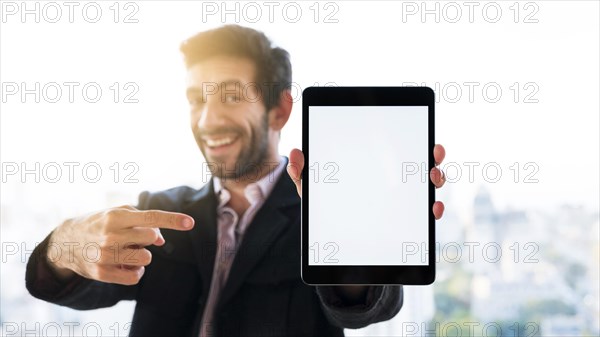 Hands showing tablet with blank screen