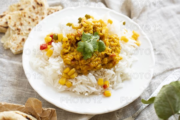 High angle rice with green peas corn