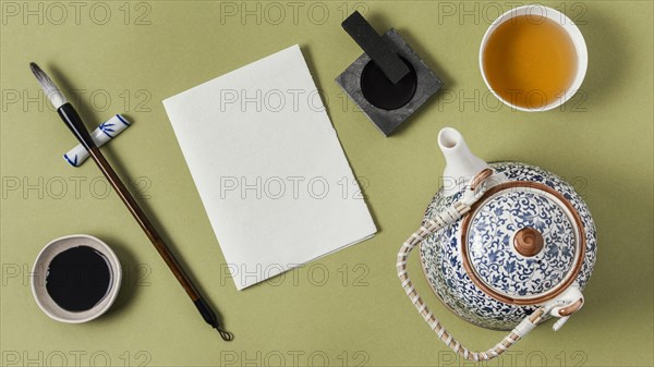Flat lay chinese ink with empty paper assortment