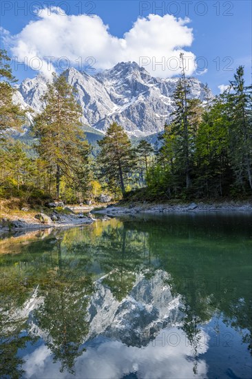 Zugspitze massif and Zugspitze reflected in Eibsee lake