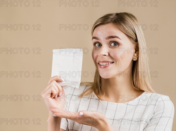 Woman showing pad medium shot