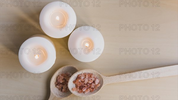 Flaming candles near salt