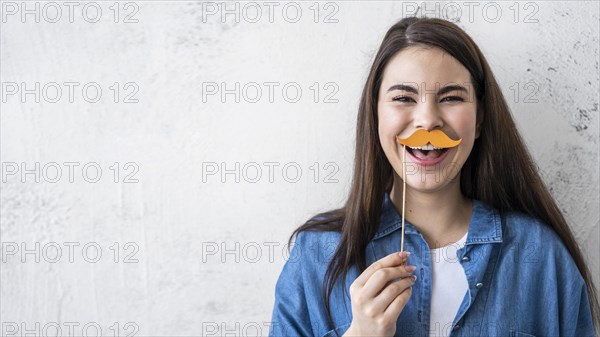 Portrait happy woman laughing with mustache
