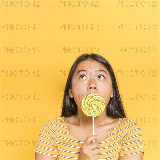 Woman covering her face staring