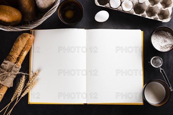 Flat lay notebook bread ingredients