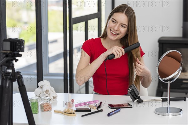 Young blogger presenting hair accessories