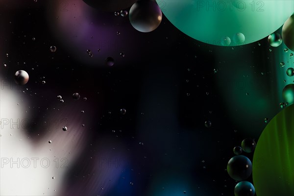 Copy space black background with colourful bubbles