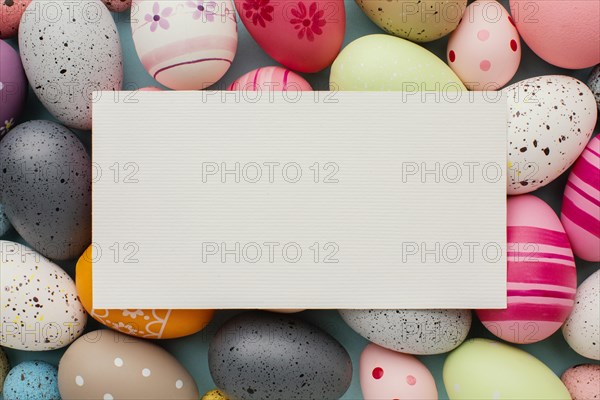 Top view colorful easter eggs with paper