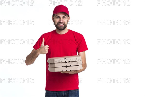 Delivery pizza boy holding boxes thumbs up copy space