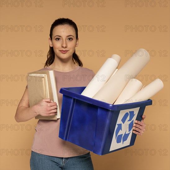 Woman casual clothes carrying reusable recycling box_3