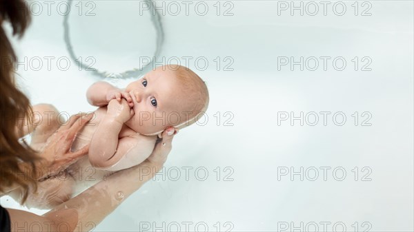 Close up woman washing baby