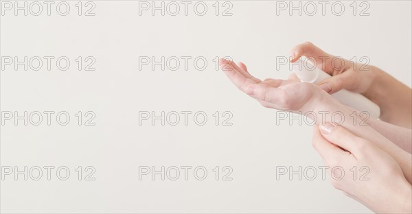 Mom son using hand sanitizer