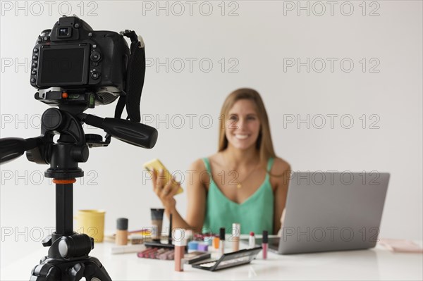High angle camera filming woman