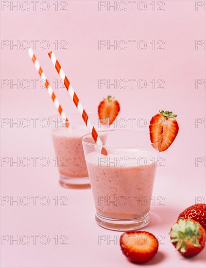 Strawberry smoothies with pink background