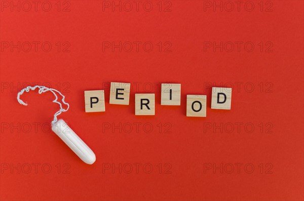 Period word with scrabble letters tampon
