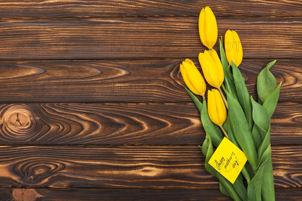 Happy mothers day inscription with tulip flowers