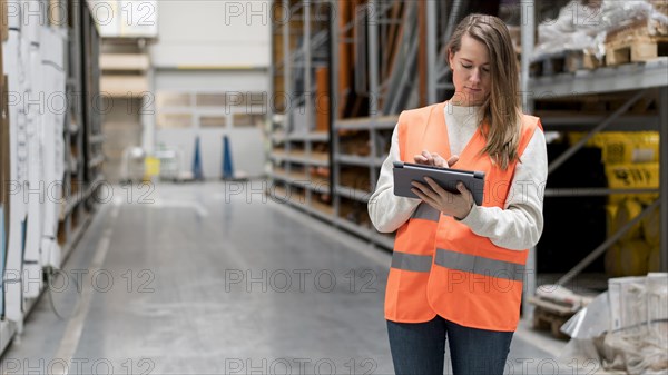 Medium shot woman with tablet