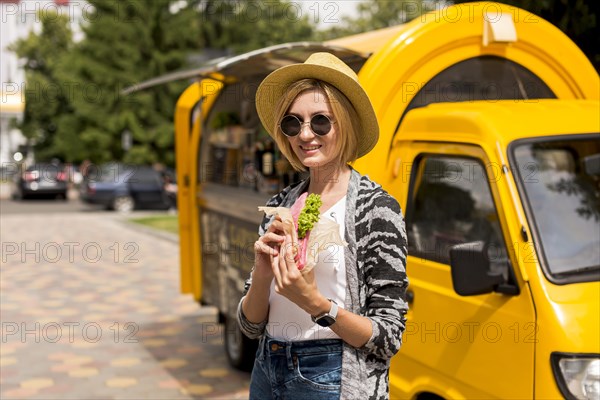 Woman standing by food truck