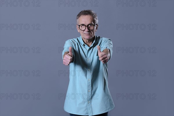 Man doing thumbs up gesture