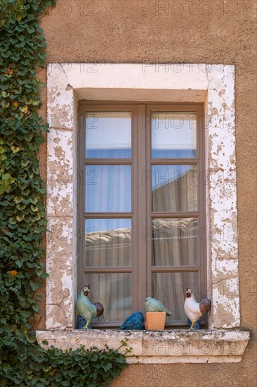 Window with various ceramics on windowsill